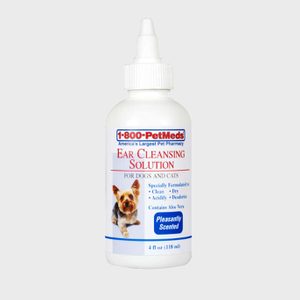 Bottle displays ear cleansing solution for dogs and cats, featuring a dog image, with text emphasizing cleaning and deodorizing benefits, aloe vera, and pleasant scent.