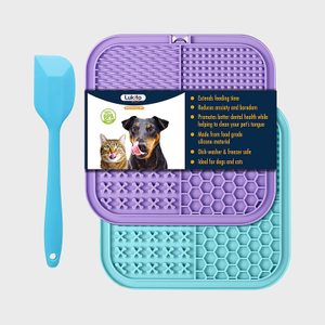 Purple and turquoise silicone pet licking mats with a blue spatula, surrounded by packaging featuring various pet benefits in a promotional design.