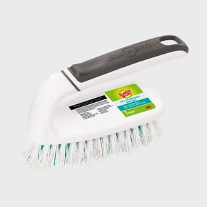 Brush with white bristles and black handle, labeled 
