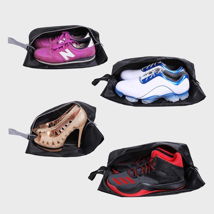 Black shoe bags displaying sneakers, high heels, and sports shoes on a plain gray background, highlighting their versatility and capacity.