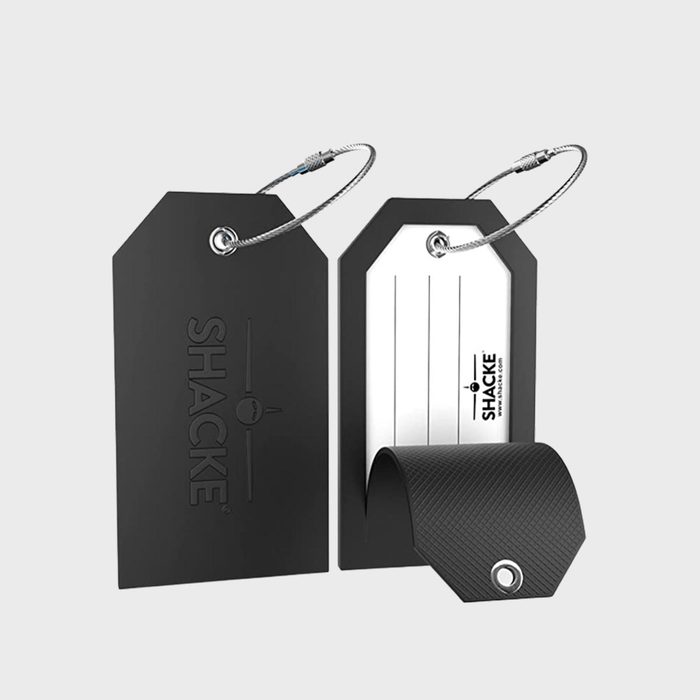 Black luggage tags display identity labels; one shows 