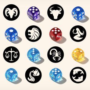 Dice in various colors scatter between zodiac symbols, including a ram, bull, twins, and more, on a neutral background.