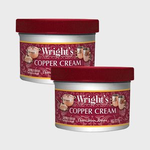 Two containers of Wright's Copper Cream with red lids, designed to clean, shine, and restore copper items; shown against a plain background.