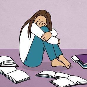A person sits hugging knees, crying, surrounded by scattered open books on a purple floor.