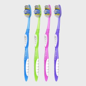 Four colorful toothbrushes stand upright against a plain background.