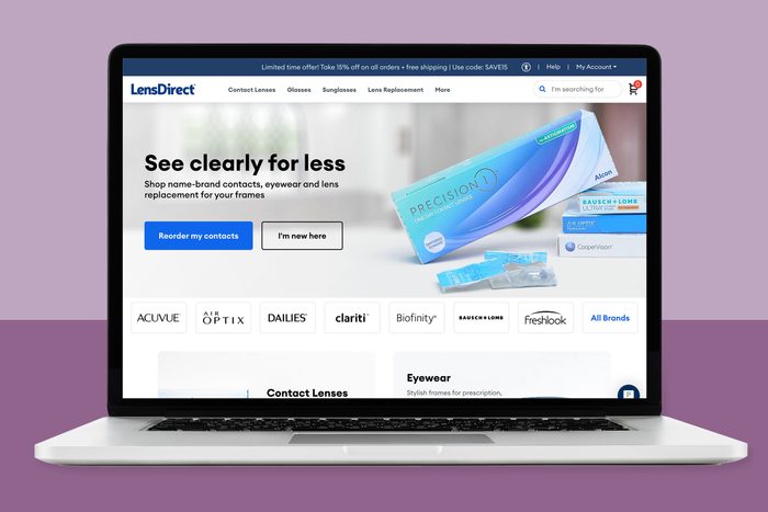 Laptop displays contact lens website, featuring product image, navigation menu, and promotional text. Background shows purple surface and wall.
