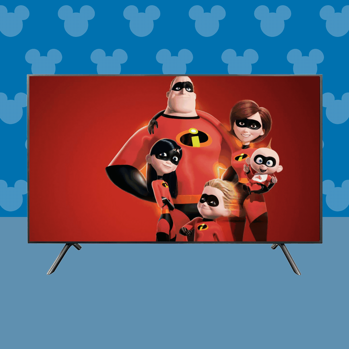 Television displaying a superhero family on a red background, set against a blue wall with a repeating Mickey Mouse pattern.