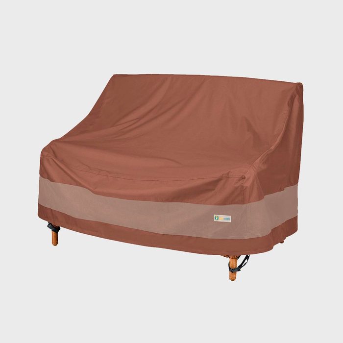 Brown fabric cover drapes over an outdoor bench; labeled 