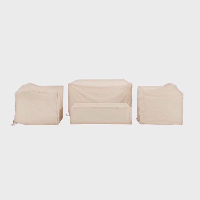 Three beige furniture covers sit atop various shaped pieces, arranged side by side, against a plain white background.