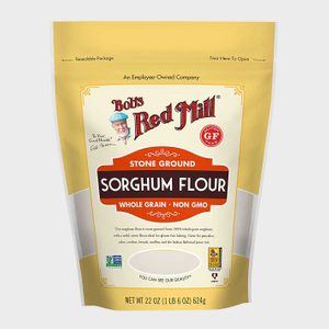 A yellow package displays â€œBob's Red Mill Sorghum Flour.â€ It's stone-ground, whole grain, non-GMO, and gluten-free. Resalable, with 22 oz contents.
