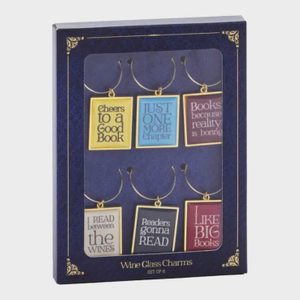 Charms hang in a box displaying book-themed phrases; blue background, gold accents, and text such as 
