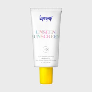 A white tube with yellow cap displays text: 