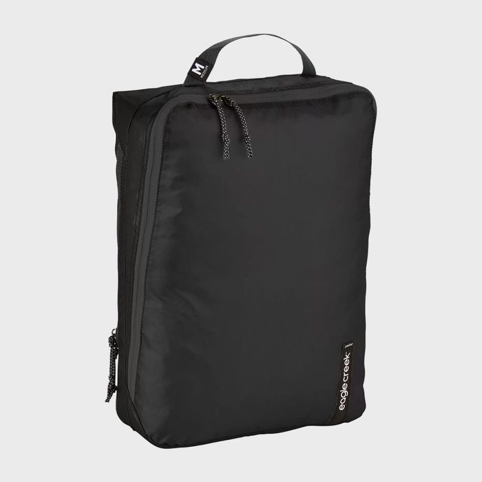 Black packing cube labeled 