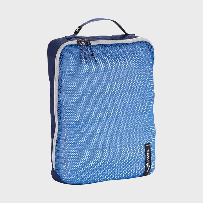 A blue mesh zipper pouch sits upright with a handle, featuring 
