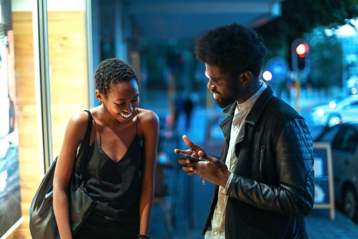 man complimenting a woman on the streets of New York City