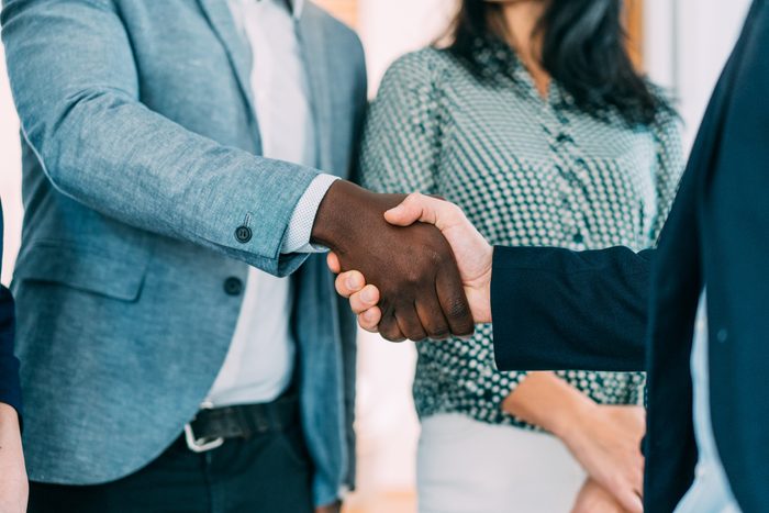 two people shaking heads in a agreement