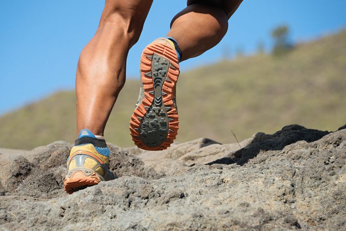 Athlete trail running in the mountains