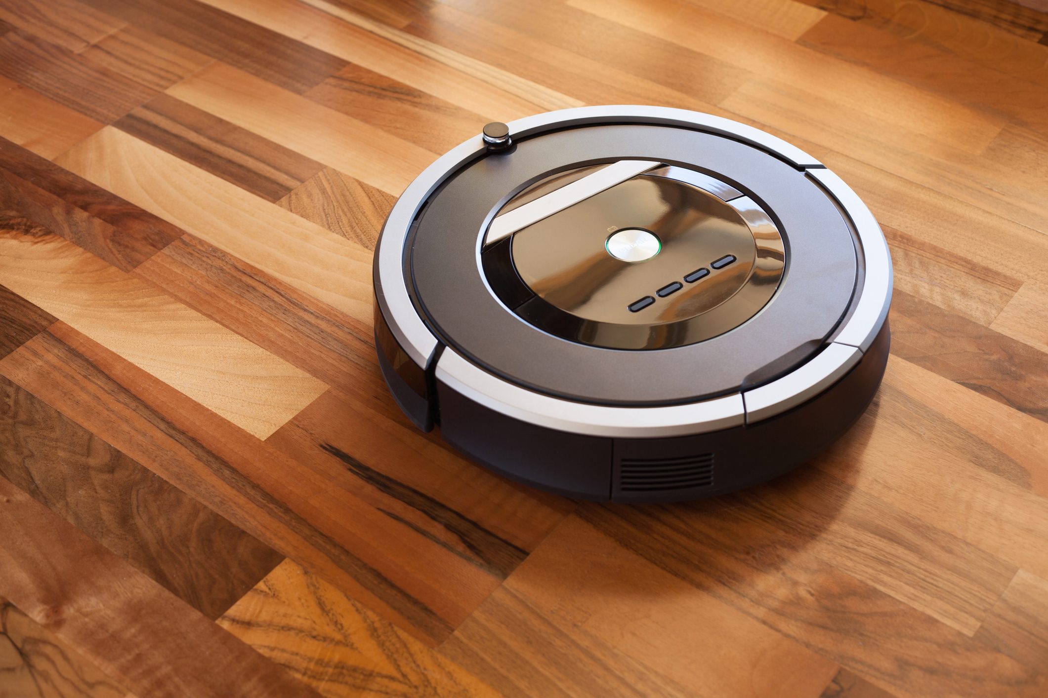 robotic vacuum cleaner on laminate wood floor smart cleaning technology
