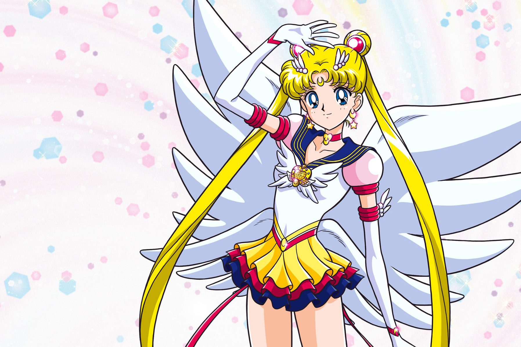 Winged anime character stands posing, wearing a colorful sailor outfit, surrounded by a pastel background with pink and blue hexagonal shapes.