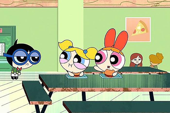 Characters sit at a cafeteria table eating, while another character stands nearby. A pizza poster hangs on the pale green wall.