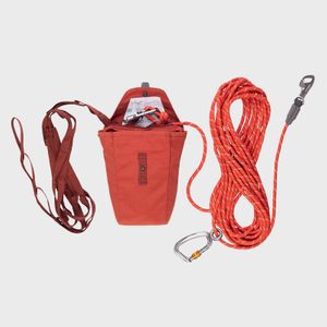 A climbing kit includes a harness, pouch with carabiners, and coiled rope, all set against a plain background.