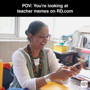Woman smiling, holding smartphone, sitting in a classroom with shelves and papers. Text reads: 