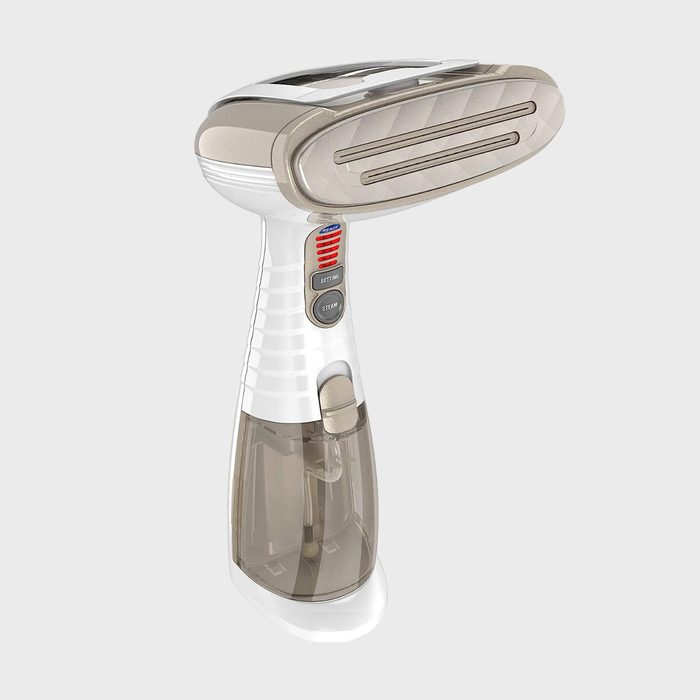 Handheld garment steamer, standing vertical, with water tank and control buttons; gray background.