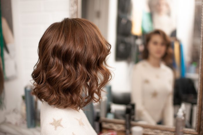 Beautiful wavy hair styling on a young woman