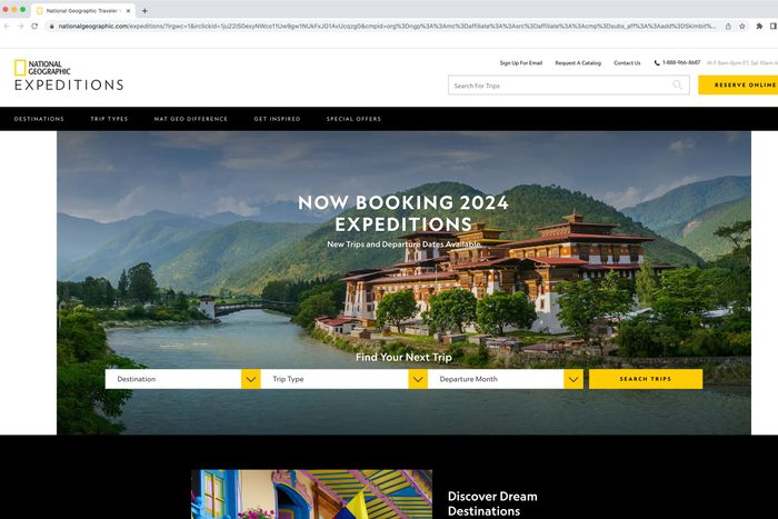 National Geographic website shows a large riverside building surrounded by green hills, advertising 