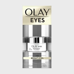 A jar of Olay Brightening Eye Cream sits in sleek packaging, promising benefits for bright eyes.