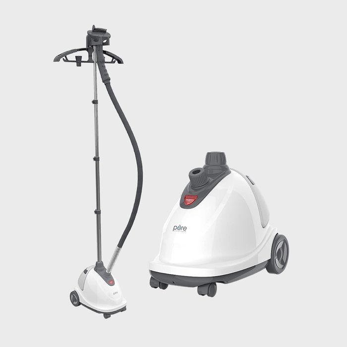 Garment steamer standing upright; hose connects to a detachable, wheeled base with a nozzle. Gray and white colors, set against a plain background.