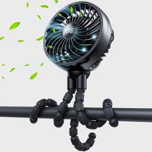 Fan blows air emitting green leaves, mounted on adjustable, flexible tripod, secured to a horizontal pole.
