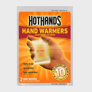 Package contains hand warmer; person holds it against a bright orange background; labeled â€œHotHands,â€ â€œUp to 10 hours of heat,â€ â€œReady to use.â€