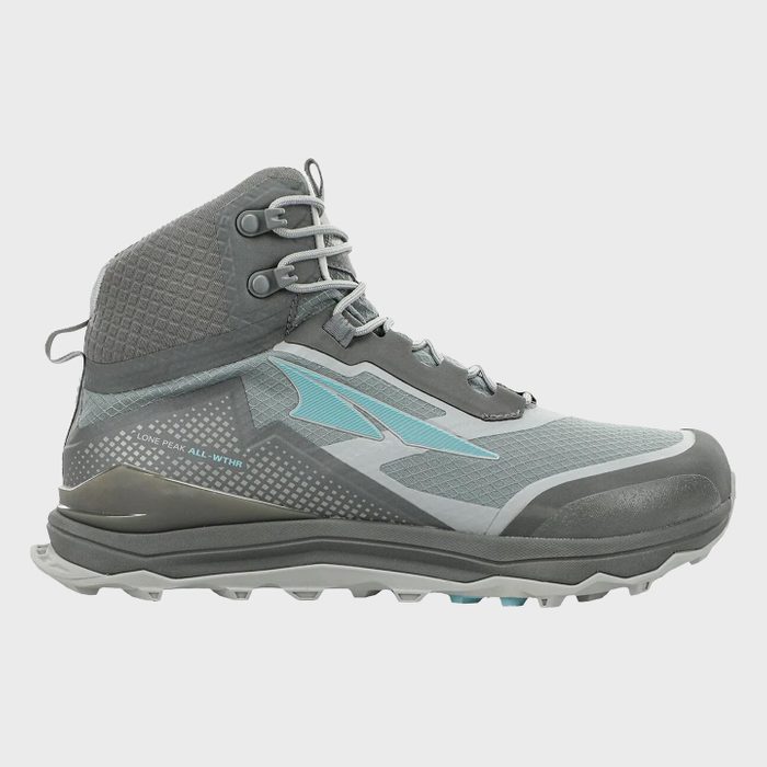 Gray and teal hiking boot displayed on a plain white background, showcasing rugged sole and sturdy, high-ankle design. Text: 