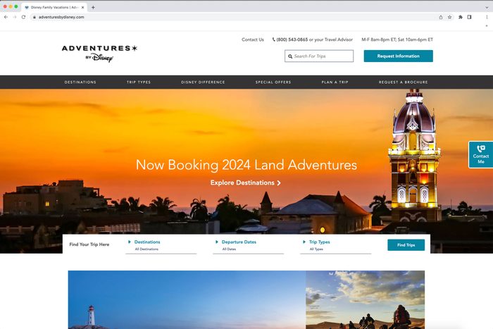 Website header displays picturesque sunset over a city, advertising 