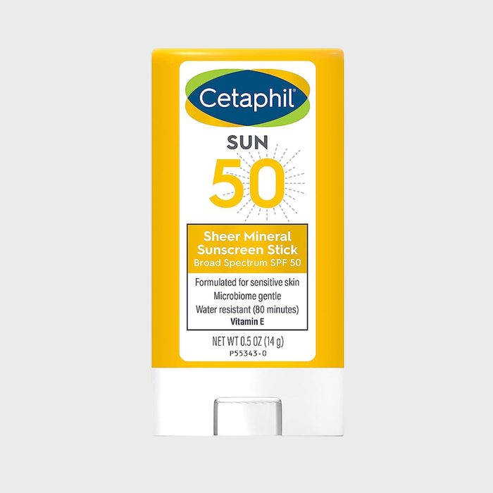 Sunscreen stick labeled Cetaphil SPF 50 with yellow packaging on a light gray background, highlighting water resistance and skin sensitivity features.