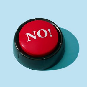 A red button labeled â€œNO!â€ rests stationary on a flat, light blue background.