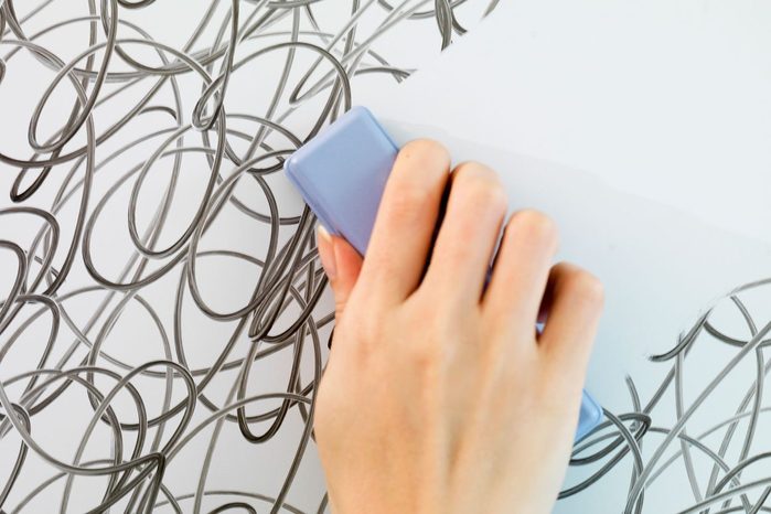 Hand Erasing The Lines Tangled