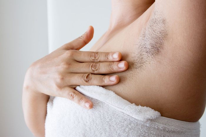 person in a white towel with arm pit hair