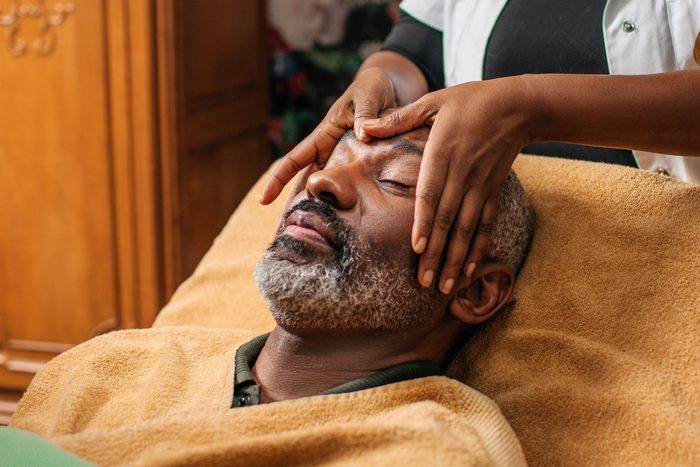 man receiving facial massage
