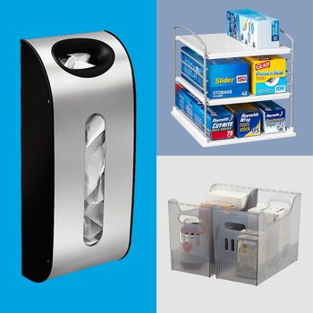 Wall-mounted bag dispenser holds plastic bags; a two-tiered shelf organizes storage bags; clear bins store packaged goods in a tidy kitchen setup.