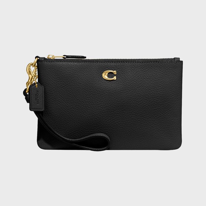 A black leather wristlet bag with gold hardware, displaying a gold 