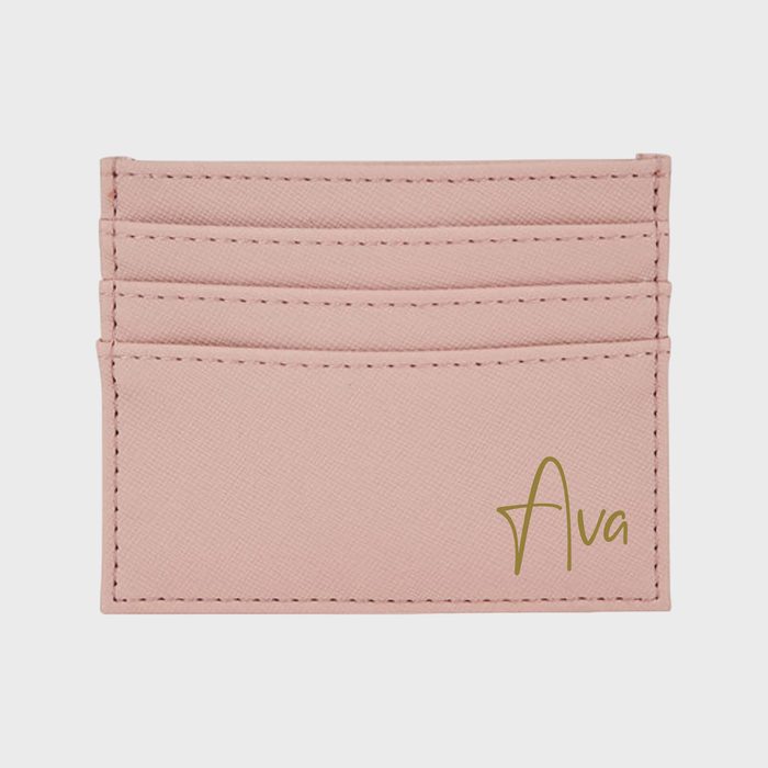 Pink cardholder displays the name 