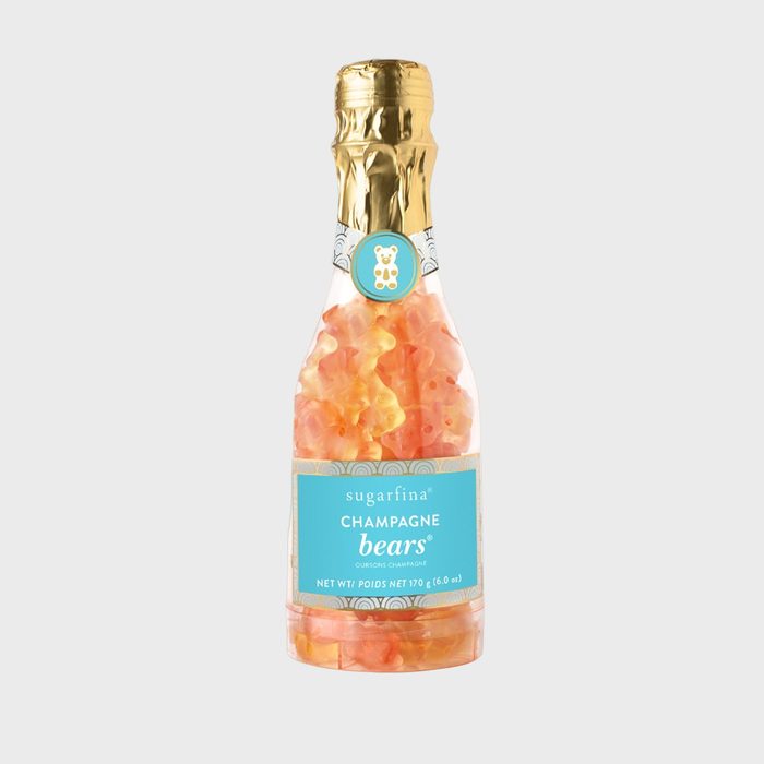 Bottle filled with gummy bears, wrapped in gold foil, labeled 