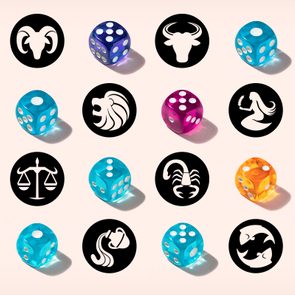 Colorful dice placed next to zodiac symbols, arranged in a grid on a light background.