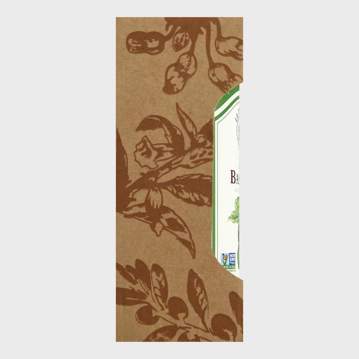 Cardboard packaging with botanical illustrations covers part of a label. The context is a simple, partially visible product package.