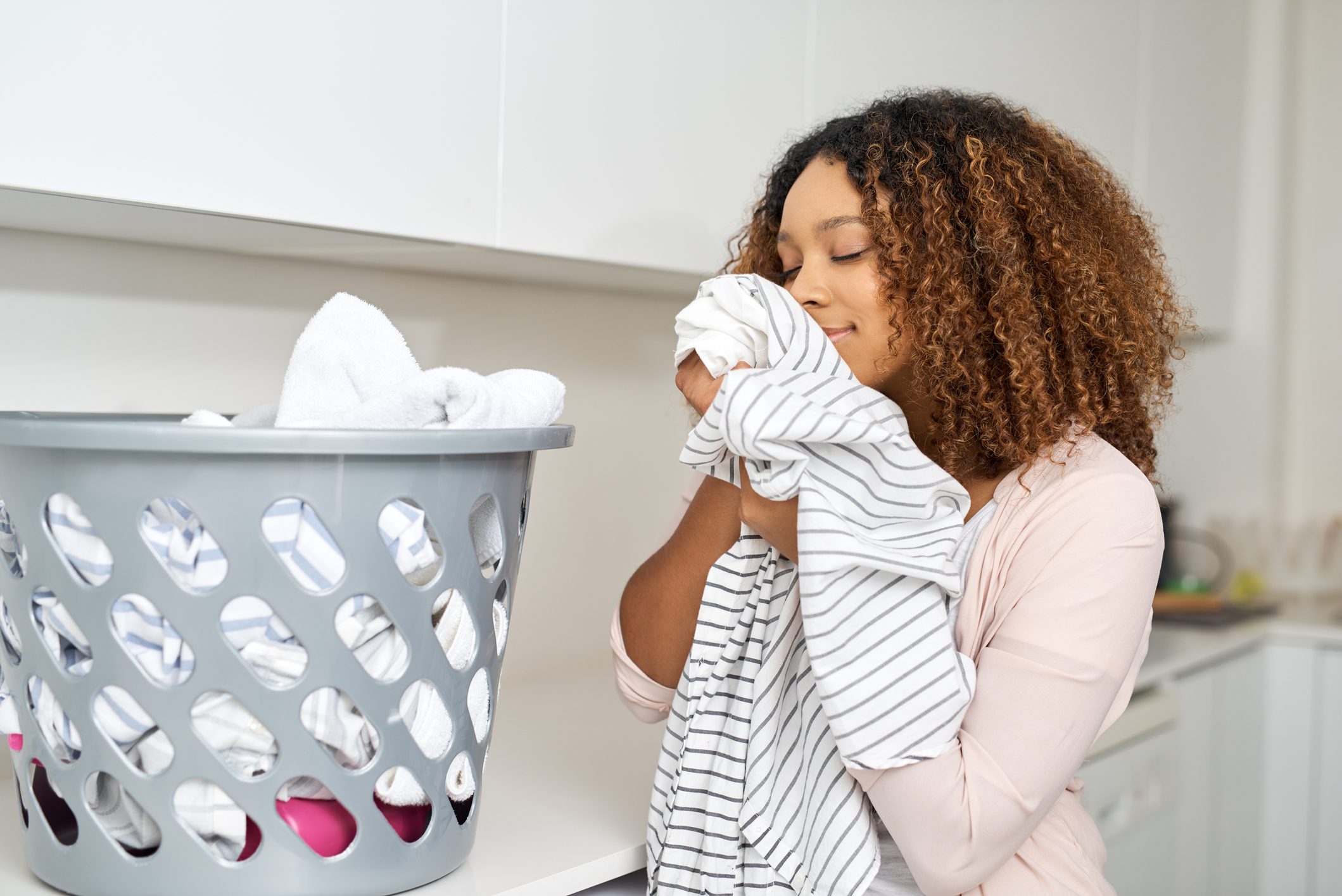 How to Get Stinky Smells Out of Your Clothes, According to Cleaning Experts