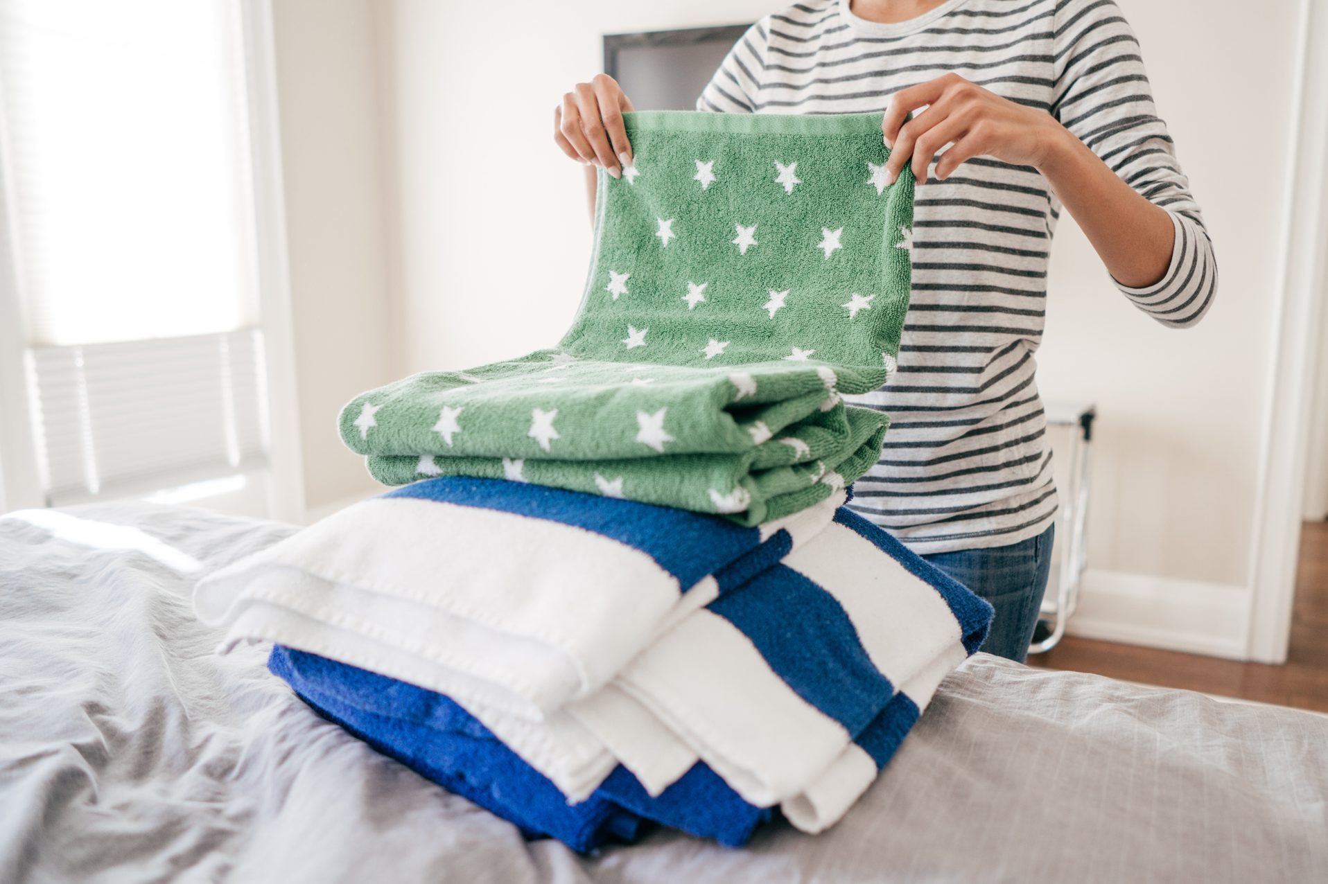 Woman folding towels