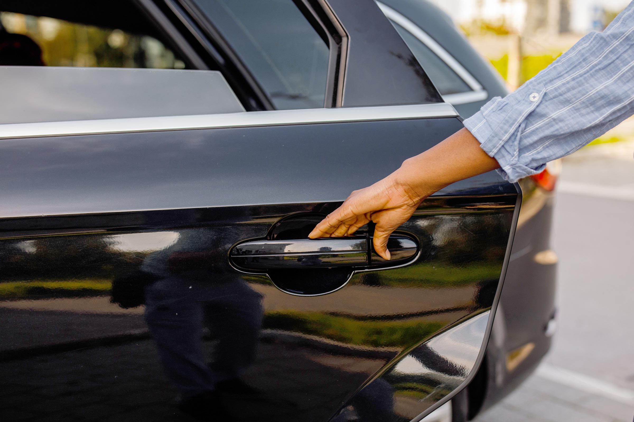 opening car door to clean the car out