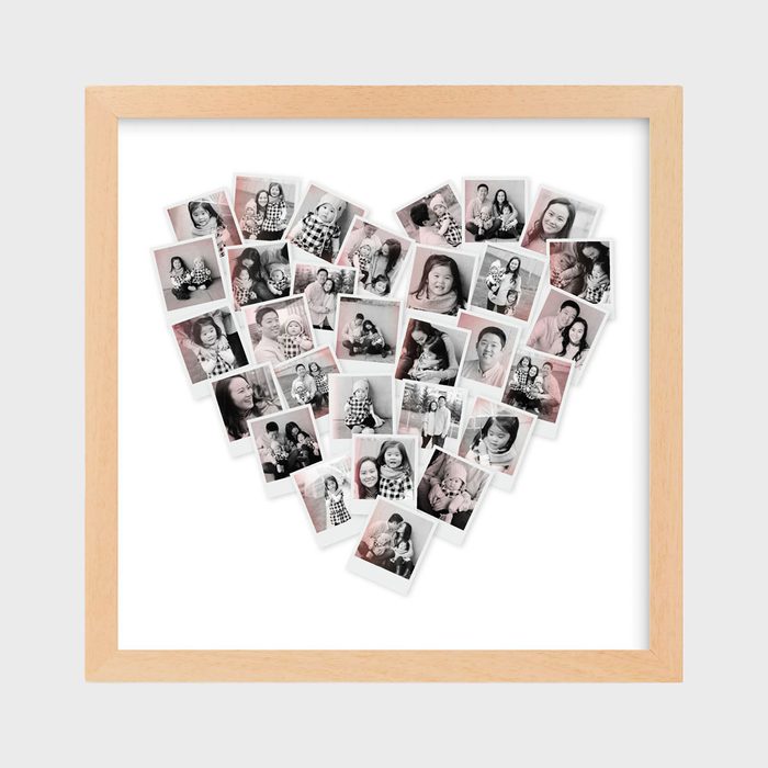 Collage of family photos arranged in a heart shape within a wooden frame, showcasing various joyful moments against a white background.